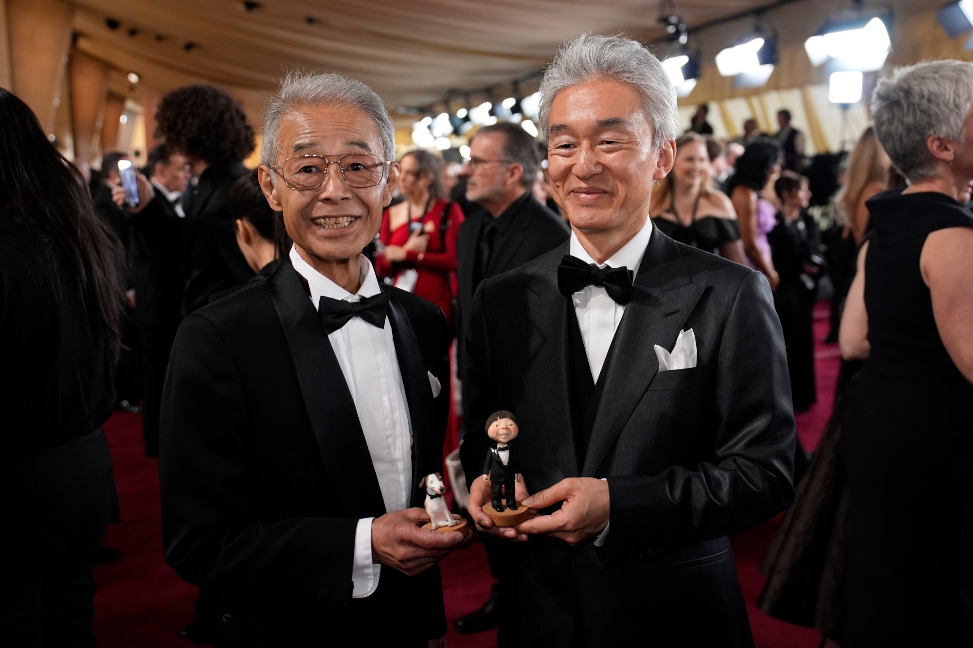 Daisuke Nishio, left, and Takashi Washio arrive at the Oscars on Sunday, March 2, 2025, at the Dolby Theatre in Los Angeles. (AP Photo/John Locher)