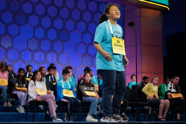 Blanche Li, 14, of Boulder reacts after unsuccessfully spelling her word in the quarterfinals of the 2025 Scripps National Spelling Bee at the Gaylord National Resort and Convention Center on May 28, 2025, in National Harbor, Maryland. (Photo by Kayla Bartkowski/Getty Images)